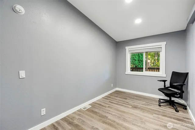 a room with a window and a chair