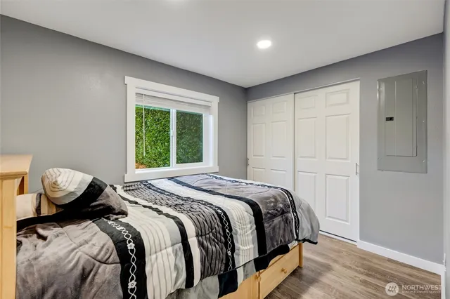 a bedroom with a bed and window