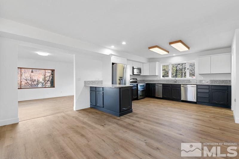 7270 Pembroke Drive Reno, NV 89502 - Photo 12 of 38 a view of kitchen with wooden floor