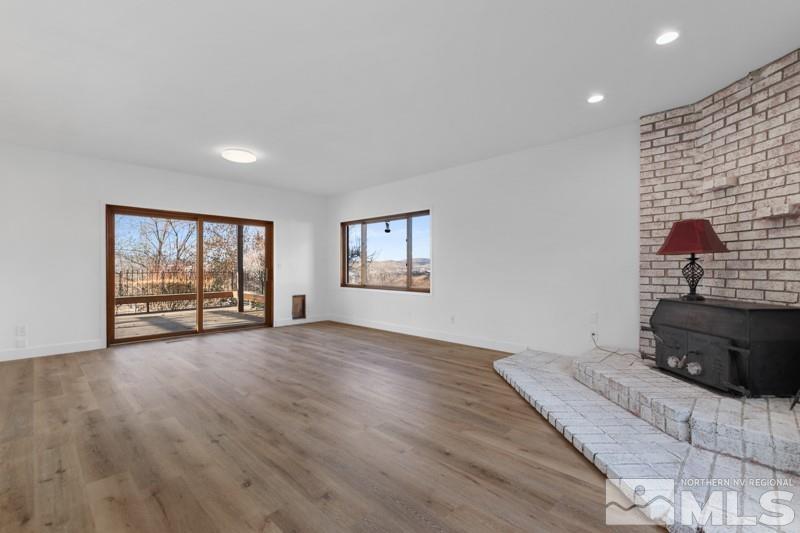 7270 Pembroke Drive Reno, NV 89502 - Photo 16 of 38 a view of a livingroom with wooden floor and a flat screen tv