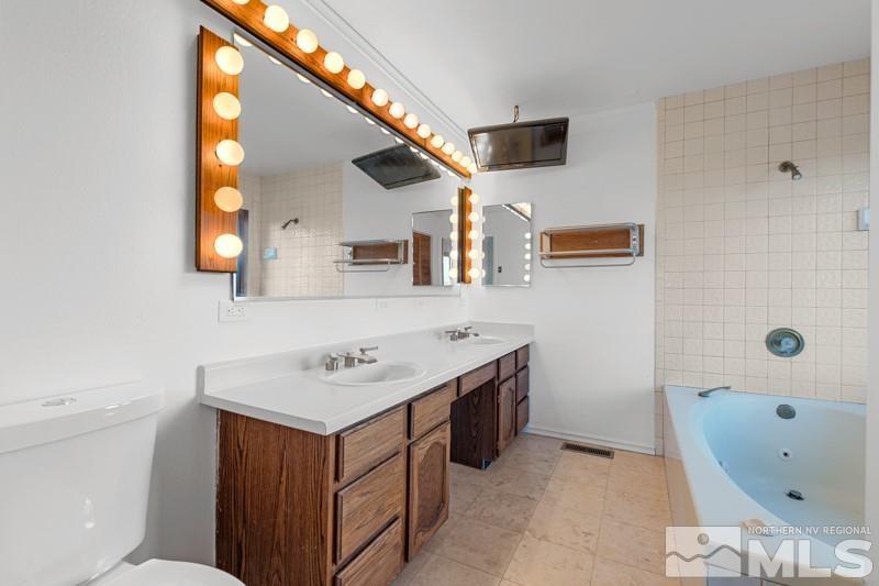 7270 Pembroke Drive Reno, NV 89502 - Photo 22 of 38 a bathroom with a sink toilet and shower