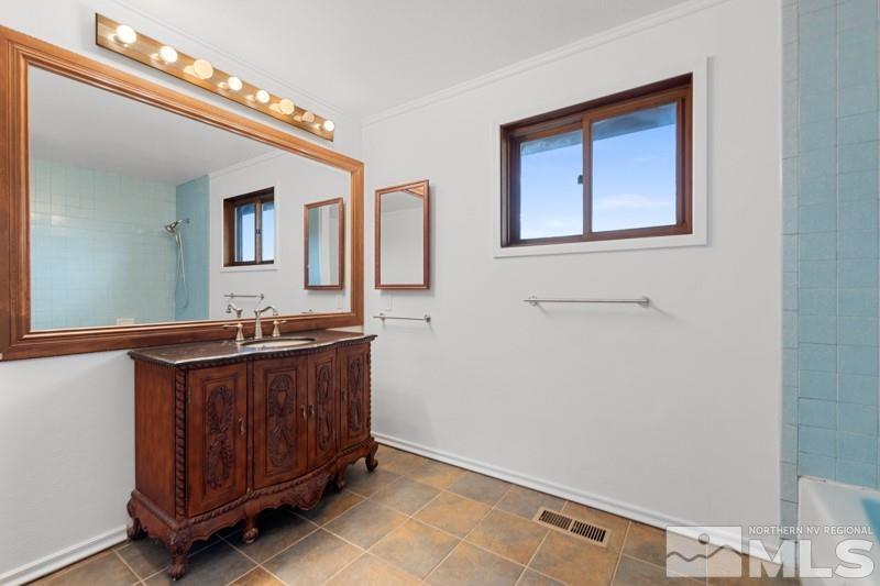 7270 Pembroke Drive Reno, NV 89502 - Photo 27 of 38 a room with a sink and a mirror