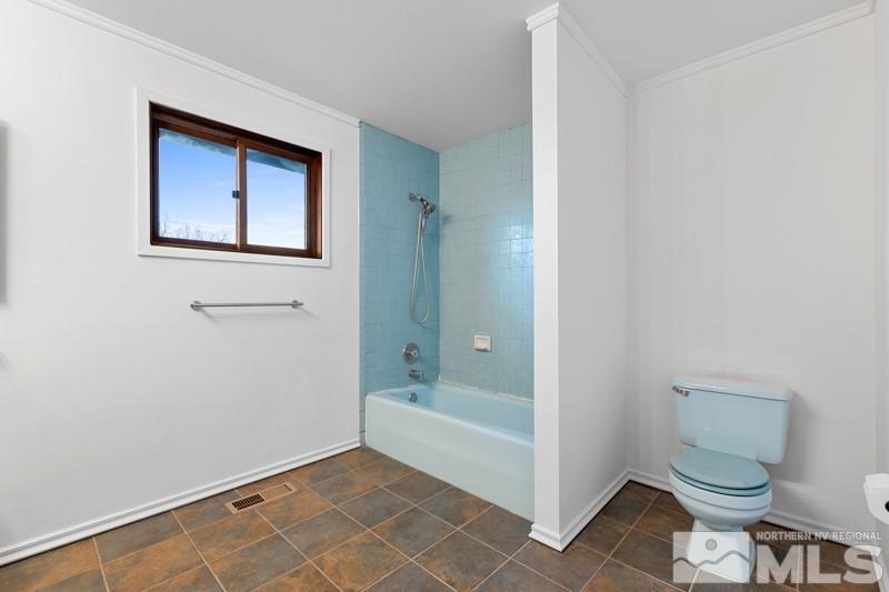 7270 Pembroke Drive Reno, NV 89502 - Photo 28 of 38 a bathroom with a toilet and a shower