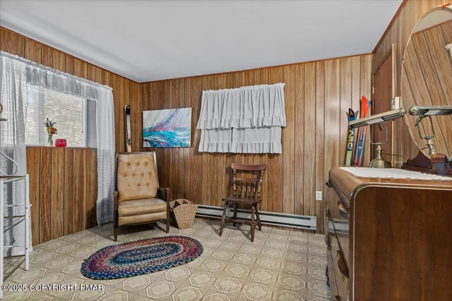 a bathroom with a toilet a sink and curtain