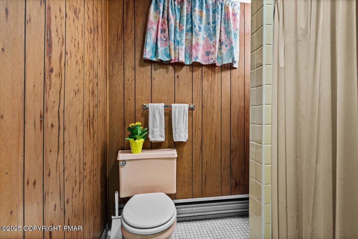 652 Rimrock Road Bartonsville, PA 18321 - Photo 22 of 37 a bathroom with a toilet a sink and curtain