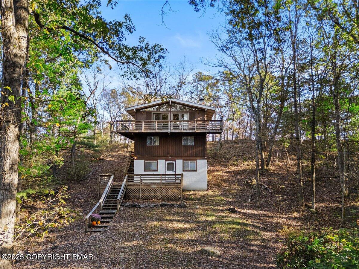 652 Rimrock Road Bartonsville, PA 18321 - Photo 30 of 37 a front view of a house with garden