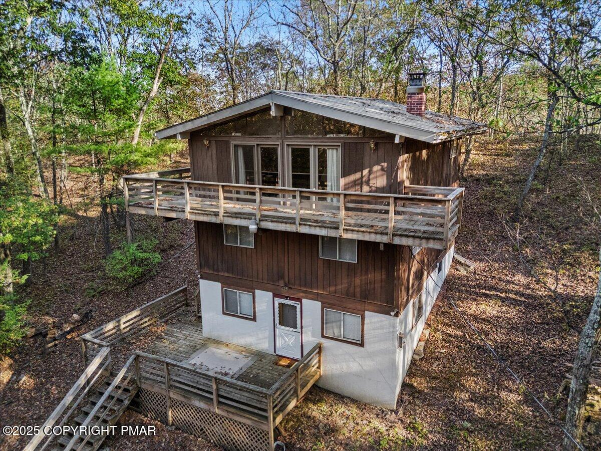 652 Rimrock Road Bartonsville, PA 18321 - Photo 32 of 37 a house with trees in front of it