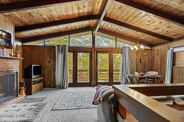 a bed room with a bed and a television