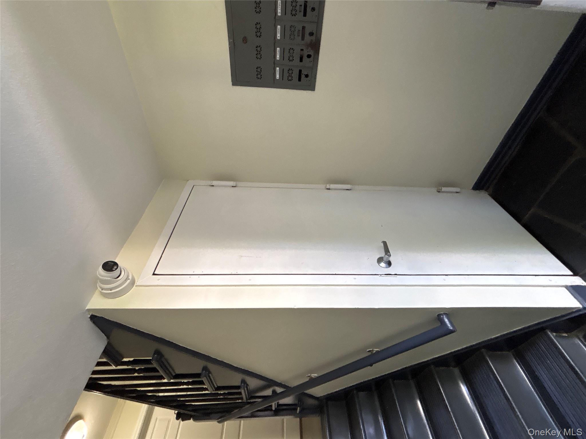 37 Spruce Street, Unit 2 Great Neck, NY 11021 - Photo 15 of 18 a view of a hallway with staircase