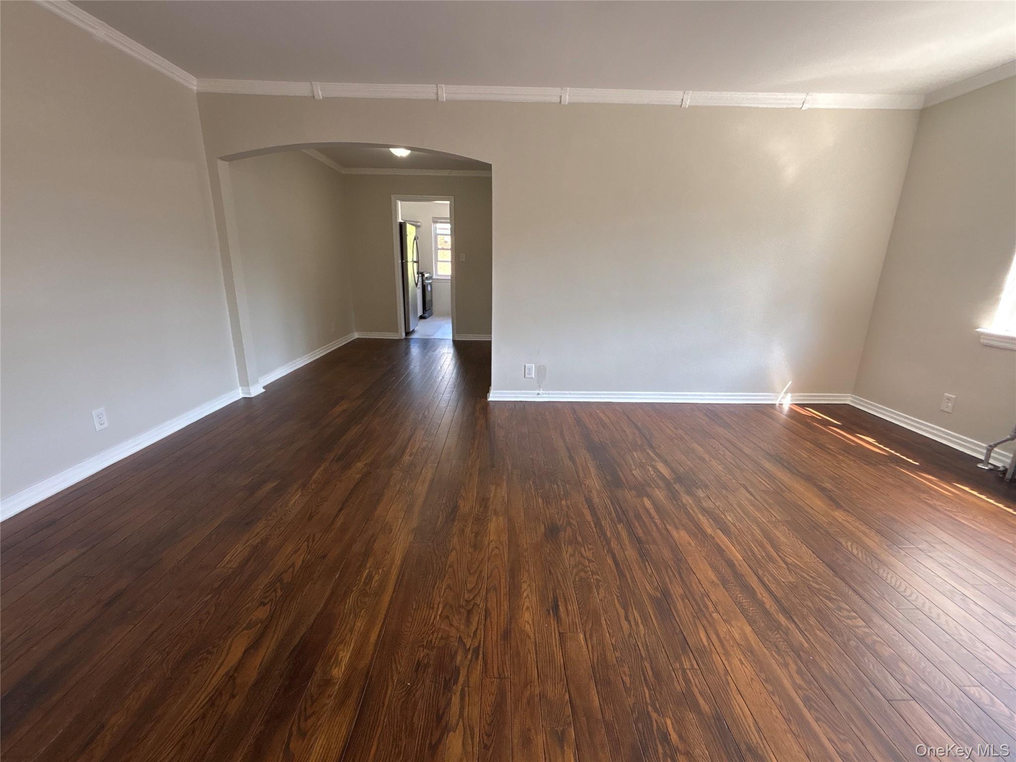 37 Spruce Street, Unit 2 Great Neck, NY 11021 - Photo 2 of 18 a view of wooden floor and brick walls