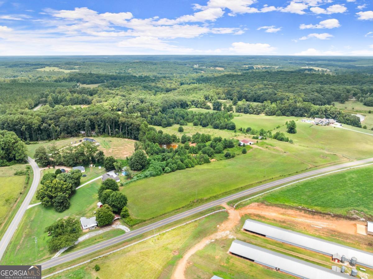 0 Jot Em Down Road, Unit TRACT 3 Danielsville, GA 30633 - Photo 8 of 9 an aerial view of residential houses with outdoor space and swimming pool