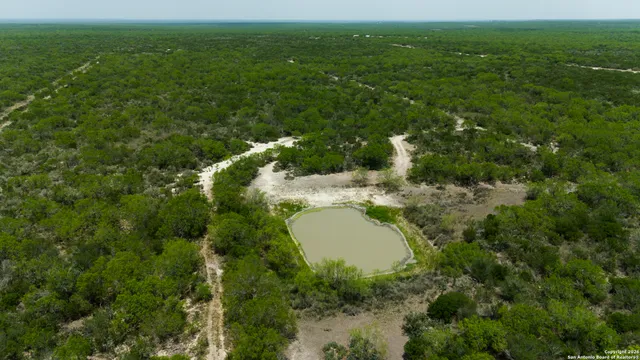 a view of a lake and green space