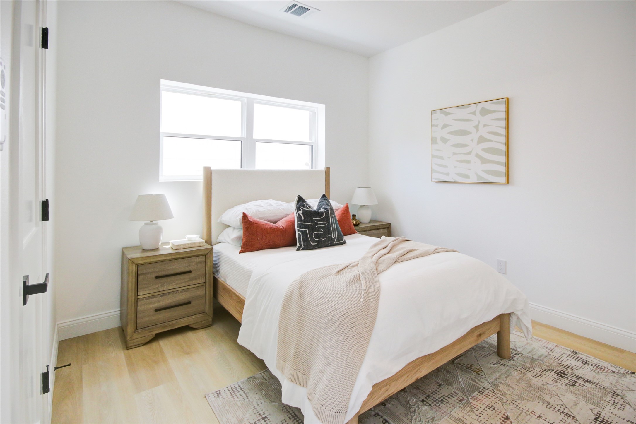 1214 West 24th Street, Unit D Houston, TX 77008 - Photo 5 of 45 a bedroom with a bed and a window