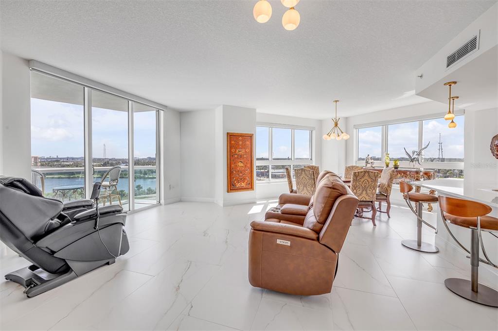231 Riverside Drive, Unit 7091 Daytona Beach, FL 32117 - Photo 11 of 90 a living room with furniture and a large window