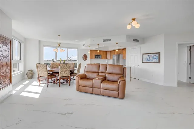 a dining room with furniture window and wooden floor