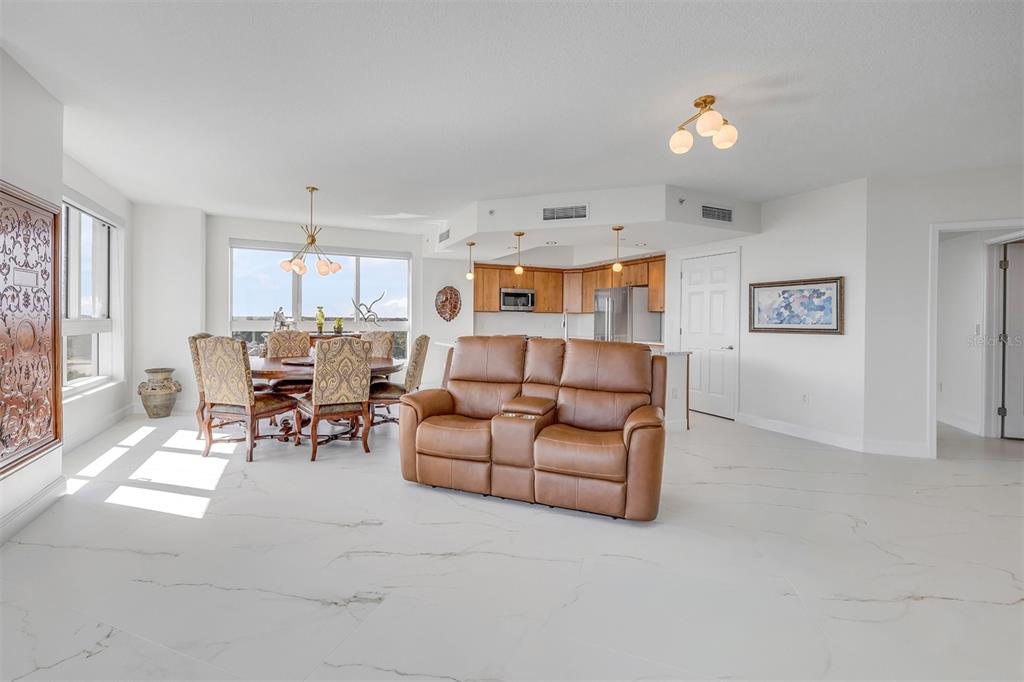 231 Riverside Drive, Unit 7091 Daytona Beach, FL 32117 - Photo 14 of 90 a living room with furniture and a table