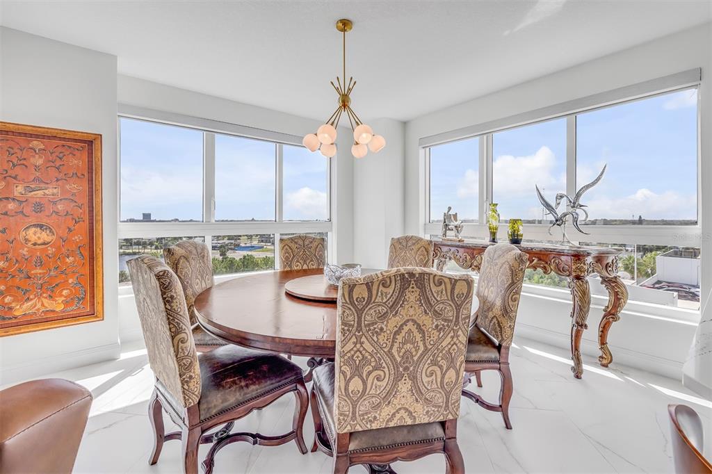 231 Riverside Drive, Unit 7091 Daytona Beach, FL 32117 - Photo 24 of 90 a dining room with furniture window and wooden floor