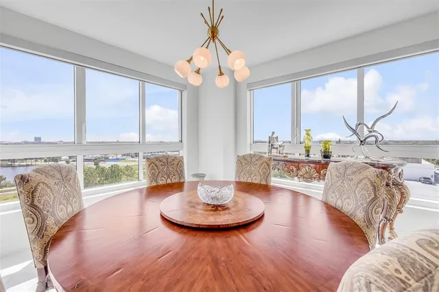 a view of a workspace with furniture and window