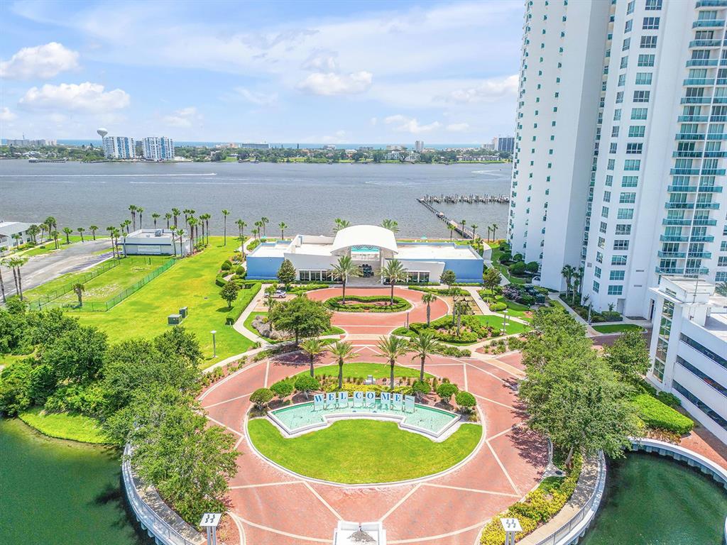 231 Riverside Drive, Unit 7091 Daytona Beach, FL 32117 - Photo 3 of 90 a view of a swimming pool with a patio and a garden