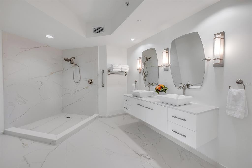 231 Riverside Drive, Unit 7091 Daytona Beach, FL 32117 - Photo 33 of 90 a spacious bathroom with a double vanity sink mirror and double