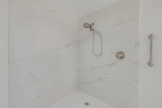 a view of a swimming pool with a lounge chairs