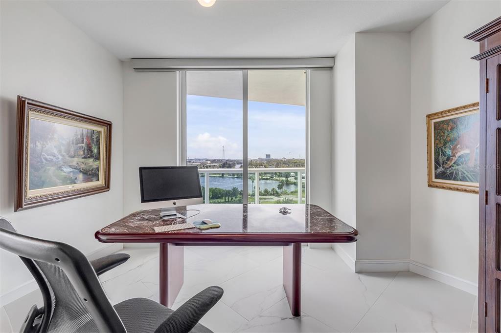 231 Riverside Drive, Unit 7091 Daytona Beach, FL 32117 - Photo 38 of 90 a view of a workspace with furniture and window