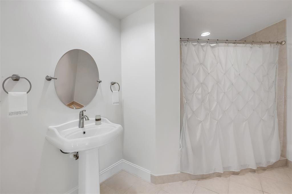 231 Riverside Drive, Unit 7091 Daytona Beach, FL 32117 - Photo 39 of 90 a bathroom with a sink and a mirror