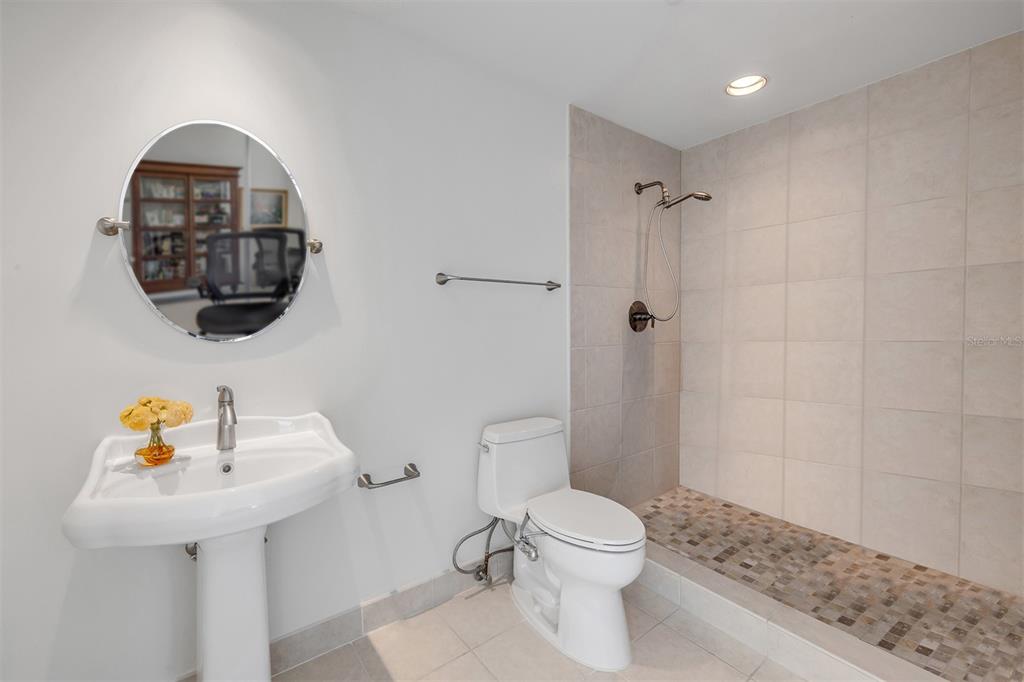 231 Riverside Drive, Unit 7091 Daytona Beach, FL 32117 - Photo 44 of 90 a bathroom with a sink a toilet and shower