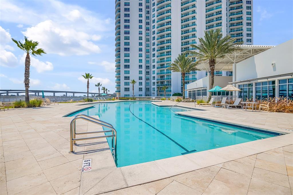231 Riverside Drive, Unit 7091 Daytona Beach, FL 32117 - Photo 53 of 90 a view of swimming pool with outdoor seating and city view