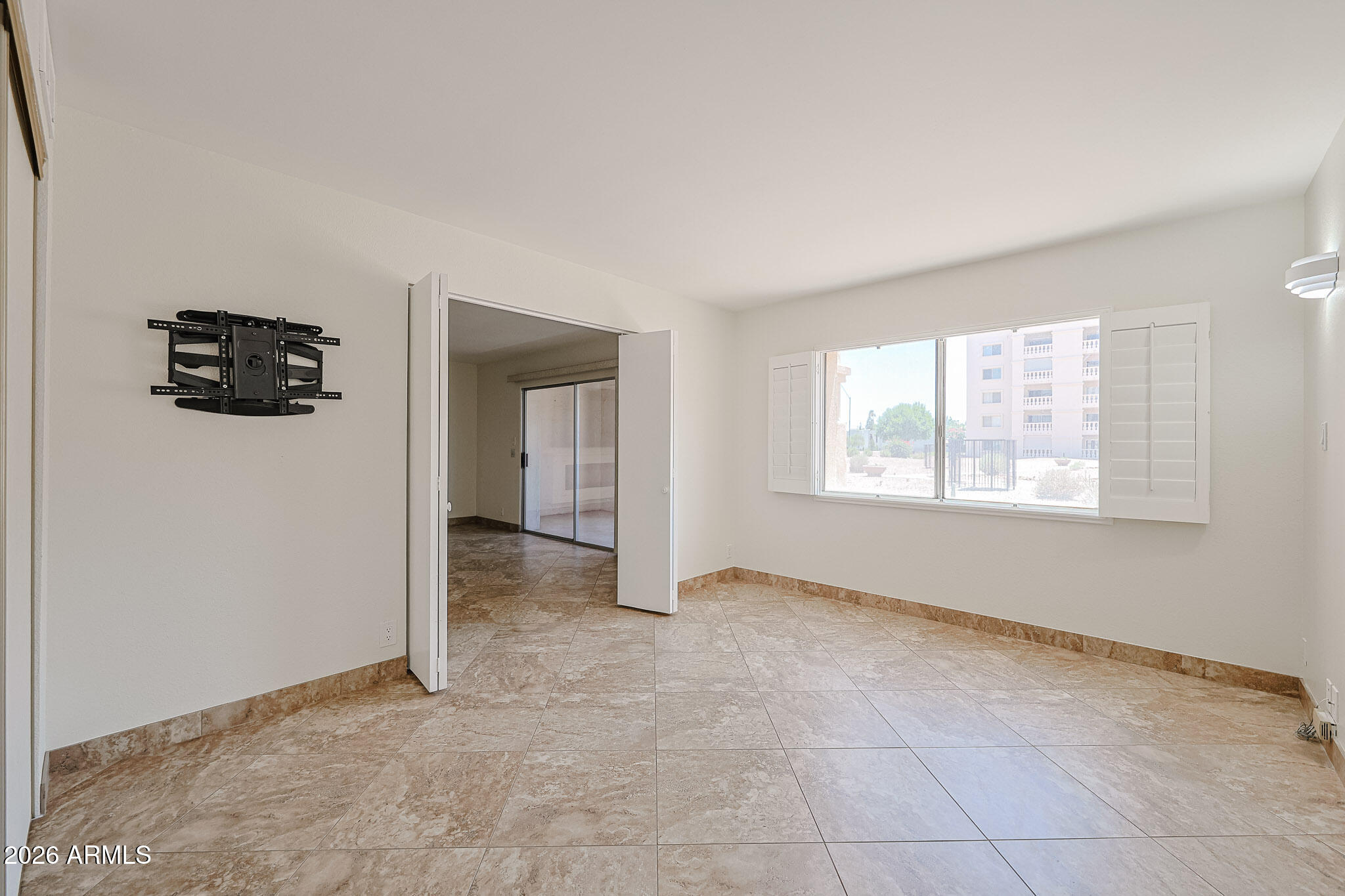 7920 East Camelback Road, Unit 111 Scottsdale, AZ 85251 - Photo 16 of 32 a view of an empty room with a window