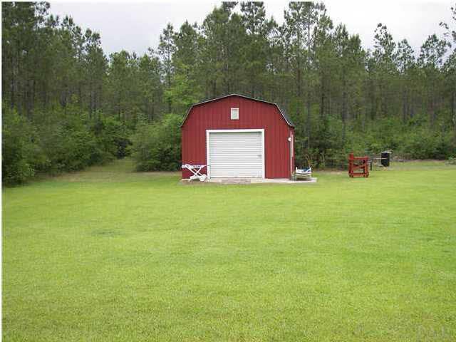 2745 Segrest Road Pace, FL 32571 - Photo 12 of 23 Nice metal building with roll up door