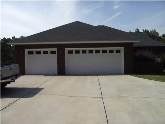 2745 Segrest Road Pace, FL 32571 - Photo 3 of 23 3 car garage has plenty of room!