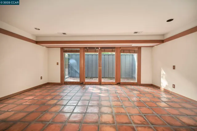a kitchen with sink a stove and cabinets