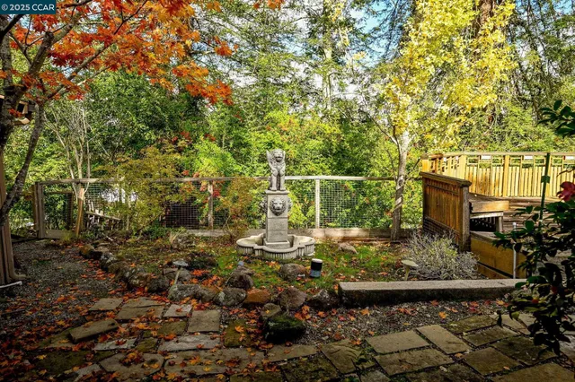 a view of a chairs and fire pit in the patio