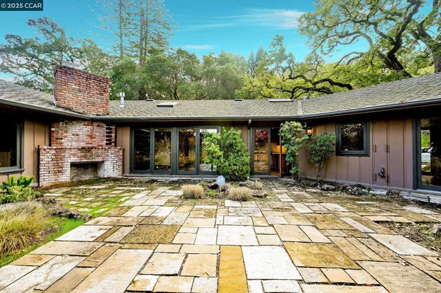 a view of yard along with trees