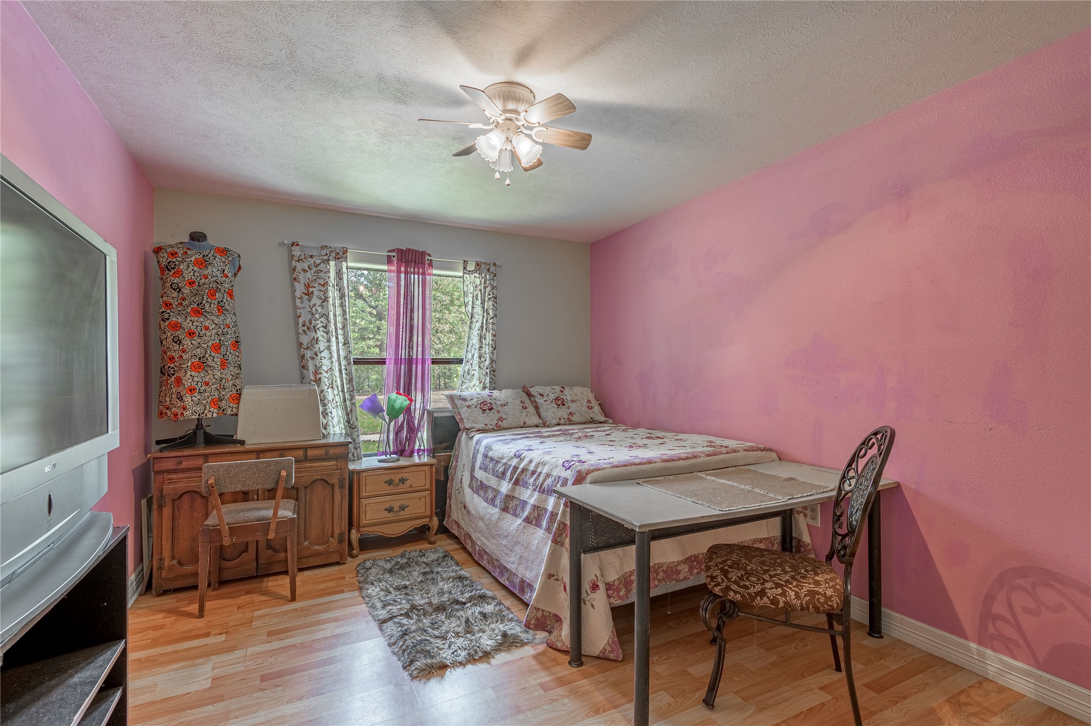 47-57 Stage Coach Road Coldspring, TX 77331 - Photo 23 of 50 a bed room with a bed and a tv