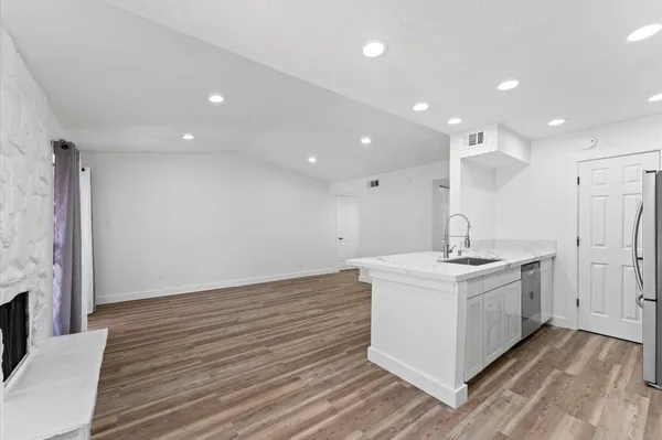 a view of a kitchen counter top space and a sink