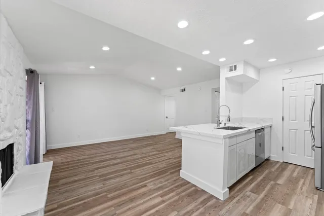 a view of a kitchen counter top space and a sink
