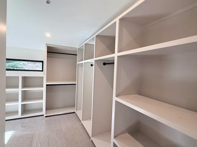 a view of an empty walk in closet