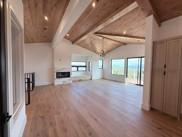 a view of livingroom with hardwood floor and a ceiling fan