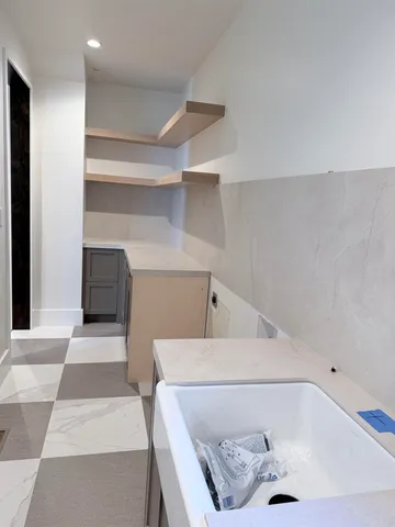 a living room with furniture and a rug