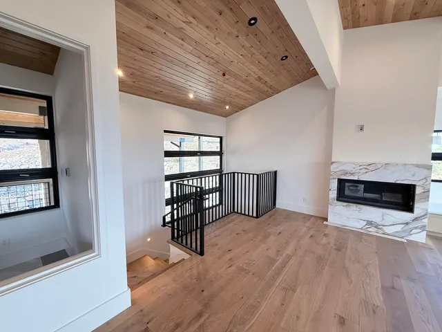 a view of a livingroom with furniture and staircase