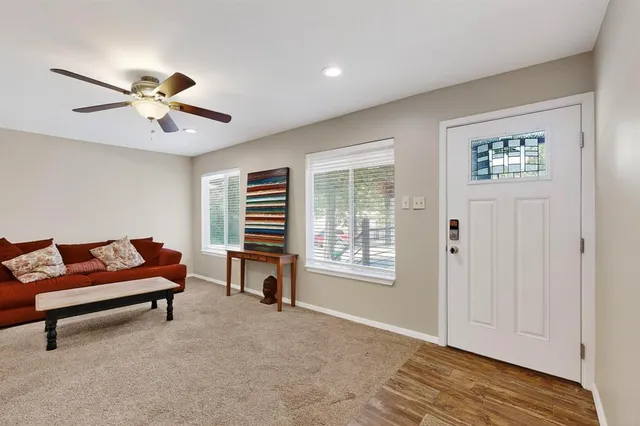 a living room with furniture and a window