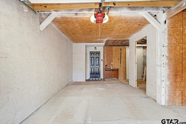a view of a hallway with a chandelier