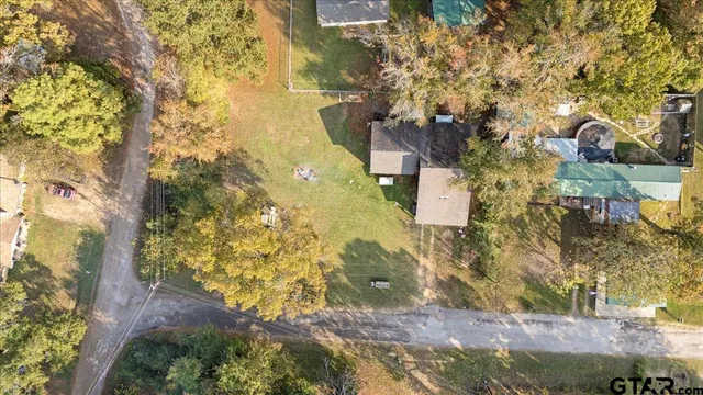 a kitchen with stainless steel appliances granite countertop a refrigerator a stove a sink dishwasher and a refrigerator with wooden floor