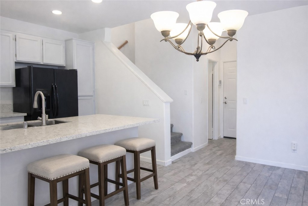 1285 Fools Gold Way, Unit 2 Chula Vista, CA 91913 - Photo 11 of 43 a kitchen with a table and chairs