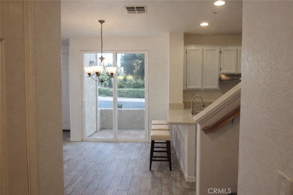 1285 Fools Gold Way, Unit 2 Chula Vista, CA 91913 - Photo 14 of 43 a view of entryway and hall with wooden floor