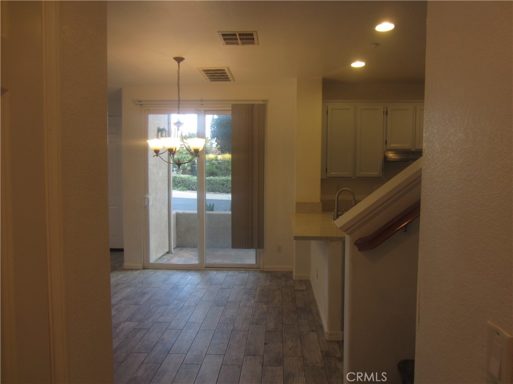 1285 Fools Gold Way, Unit 2 Chula Vista, CA 91913 - Photo 15 of 43 a view of entryway and hall with wooden floor