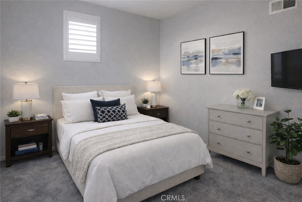 1285 Fools Gold Way, Unit 2 Chula Vista, CA 91913 - Photo 20 of 43 a bedroom with a bed and a flat tv screen on the dresser