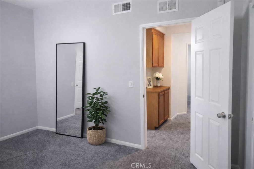 1285 Fools Gold Way, Unit 2 Chula Vista, CA 91913 - Photo 22 of 43 an empty room and a fountain in a gallery